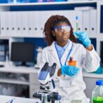 Accueil african american woman scientist holding test tube at laboratory